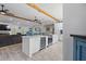 Open floor plan connects kitchen to living room, features island with wine fridge at 2820 Whitney Rd, Clearwater, FL 33760