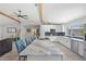 Open kitchen features marble countertop, white cabinets, and bar seating at 2820 Whitney Rd, Clearwater, FL 33760