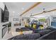 Open-concept living space featuring a fireplace, comfortable seating, and modern decor with backyard views at 2820 Whitney Rd, Clearwater, FL 33760
