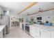 Spacious open concept living room and kitchen with fireplace and modern design at 2820 Whitney Rd, Clearwater, FL 33760