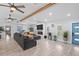 Bright living room with wood-look flooring, comfortable seating, and modern decor at 2820 Whitney Rd, Clearwater, FL 33760