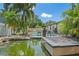 Backyard oasis with pool, rock waterfall, and tropical landscaping at 2820 Whitney Rd, Clearwater, FL 33760