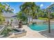 Lush backyard with pool and rock waterfall at 2820 Whitney Rd, Clearwater, FL 33760