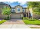 Charming townhome with well-maintained landscaping, brick paved driveway, and attached two-car garage at 28504 Tranquil Lake Cir, Wesley Chapel, FL 33543