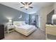 Comfortable main bedroom with natural light, neutral decor, carpeted flooring, and a serene ambiance at 28504 Tranquil Lake Cir, Wesley Chapel, FL 33543