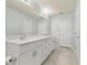 Bathroom boasts a double sink vanity with modern fixtures and tile flooring at 2885 Deer Pine Trl, Land O Lakes, FL 34638