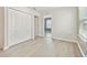 Bright bedroom boasts hardwood floors, closet, and doorway to additional room at 2885 Deer Pine Trl, Land O Lakes, FL 34638
