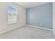 Bedroom with a window and blue wall at 2885 Deer Pine Trl, Land O Lakes, FL 34638