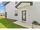 Stylish exterior with a covered entryway and well-maintained lawn and landscaping at 2885 Deer Pine Trl, Land O Lakes, FL 34638