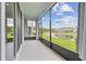 View from screened-in patio overlooking the community pond at 2885 Deer Pine Trl, Land O Lakes, FL 34638