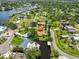 Aerial view of a waterfront property with canals, lush greenery and private boat dock at 301 Carlyle Blvd, Ruskin, FL 33570