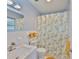 Updated bathroom with sink, vanity, and leaf-themed shower curtain at 301 Carlyle Blvd, Ruskin, FL 33570