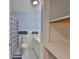 Renovated bathroom features blue and white accents at 301 Carlyle Blvd, Ruskin, FL 33570