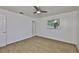 Bright bedroom with wood-look flooring and a ceiling fan at 301 Carlyle Blvd, Ruskin, FL 33570