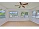 Unfurnished room with canal views, tile floors and ceiling fan at 301 Carlyle Blvd, Ruskin, FL 33570