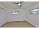 Bedroom featuring wood-look floors, a door and a window at 301 Carlyle Blvd, Ruskin, FL 33570
