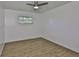 Light filled bedroom with wood-look flooring at 301 Carlyle Blvd, Ruskin, FL 33570