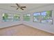 Unfurnished room with canal views, tile floors and ceiling fan at 301 Carlyle Blvd, Ruskin, FL 33570