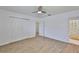 Bedroom with vinyl flooring, closet, and ensuite bathroom at 301 Carlyle Blvd, Ruskin, FL 33570