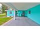 Attached car port with room for seating and covered access to the home at 301 Carlyle Blvd, Ruskin, FL 33570
