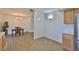 View of the dining area featuring tile floors and a view into the kitchen at 301 Carlyle Blvd, Ruskin, FL 33570