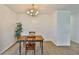 Dining area features modern lighting and transitions to kitchen and living space at 301 Carlyle Blvd, Ruskin, FL 33570