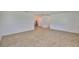 Spacious living room with wood-look flooring leading into dining area at 301 Carlyle Blvd, Ruskin, FL 33570