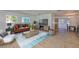 Cozy living room beautifully furnished, adjacent to dining area and kitchen at 301 Carlyle Blvd, Ruskin, FL 33570