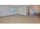 Living room showcases wood-look flooring and an open layout at 301 Carlyle Blvd, Ruskin, FL 33570