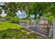 Canal view showcasing a private boat dock, lush greenery, and tranquil waters, perfect for boating and enjoying waterfront living at 301 Carlyle Blvd, Ruskin, FL 33570