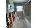 Updated bathroom with white tile walls, modern fixtures, and new toilet and shower at 3014 58Th S St, Gulfport, FL 33707