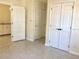 Bright bedroom featuring terrazzo floors and ample closet space at 3014 58Th S St, Gulfport, FL 33707