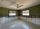 This is a bedroom showcasing natural light from windows, a ceiling fan, and design potential at 3014 58Th S St, Gulfport, FL 33707
