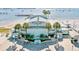 Aerial view of the Gulfport Casino, a beautiful waterfront building with palm trees and a view of the ocean at 3014 58Th S St, Gulfport, FL 33707