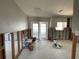 Renovation project: Kitchen awaiting completion, with exposed studs, concrete floors, and access to lanai at 3014 58Th S St, Gulfport, FL 33707
