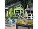 Stella's Fine Diner exterior, showcasing outdoor seating with colorful chairs and lush plants, promising a delightful experience at 3014 58Th S St, Gulfport, FL 33707