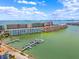 Stunning aerial view of waterfront condos with boat docks, offering a luxurious coastal lifestyle at 3018 59Th S St # 405, Gulfport, FL 33707