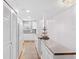 Bright kitchen with white cabinets, wood floors and stainless countertop breakfast bar at 3018 59Th S St # 405, Gulfport, FL 33707