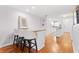 Stylish kitchen view showcasing a breakfast bar with seating, white cabinets, and hardwood floors throughout at 3018 59Th S St # 405, Gulfport, FL 33707