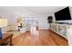 Bright living room featuring hardwood floors, contemporary furniture, and a seamless flow to the adjoining room at 3018 59Th S St # 405, Gulfport, FL 33707