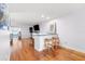 Living room with breakfast bar and wood floors; plenty of natural light at 3018 59Th S St # 405, Gulfport, FL 33707