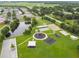 Beautiful community park featuring a pond, playground, tennis courts, and picnic areas for residents at 31244 Baclan Dr, Wesley Chapel, FL 33545