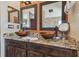 Chic bathroom featuring a double sink vanity with granite counters and updated lighting at 31244 Baclan Dr, Wesley Chapel, FL 33545