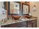 Elegant bathroom with dual vessel sinks, granite countertops, and stylish bronze fixtures at 31244 Baclan Dr, Wesley Chapel, FL 33545