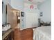 Cozy bedroom with wood floors, closet, and easy access to the kitchen and hallway at 31244 Baclan Dr, Wesley Chapel, FL 33545