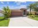Beautiful single-Gathering home with a two-car garage and well-manicured landscaping at 31244 Baclan Dr, Wesley Chapel, FL 33545