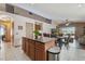 Kitchen island with stone countertop, eat in kitchen, and stainless steel appliances at 31244 Baclan Dr, Wesley Chapel, FL 33545