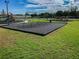 Community playground featuring swings and climbing structures surrounded by green space at 31244 Baclan Dr, Wesley Chapel, FL 33545