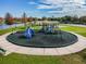 Community playground with climbing structure, swings and slide at 31244 Baclan Dr, Wesley Chapel, FL 33545
