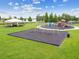 Community playground with swings, climbing structure, and covered picnic area, perfect for Gathering fun outdoors at 31244 Baclan Dr, Wesley Chapel, FL 33545